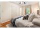 Bedroom featuring a comfortable bed, hardwood floors, and ample closet space at 2163 Medfield Ne Trl, Chamblee, GA 30345