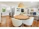 Open concept dining and kitchen with a round table and modern stainless steel appliances at 2163 Medfield Ne Trl, Chamblee, GA 30345