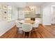 Bright dining area with a stylish light fixture and hardwood floors at 2163 Medfield Ne Trl, Chamblee, GA 30345