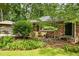 Well-manicured front yard showcasing the charming brick facade of the home at 2163 Medfield Ne Trl, Chamblee, GA 30345