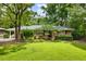 Charming brick home with a well-maintained front yard and mature trees at 2163 Medfield Ne Trl, Chamblee, GA 30345