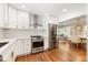 Bright kitchen with modern stainless steel appliances and a seamless flow into the dining area at 2163 Medfield Ne Trl, Chamblee, GA 30345