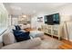 Cozy living room with a large TV and stylish furnishings, perfect for relaxation at 2163 Medfield Ne Trl, Chamblee, GA 30345