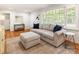 Comfortable living room with hardwood floors, a plush sofa, and modern decor at 2163 Medfield Ne Trl, Chamblee, GA 30345
