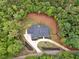 An aerial view of the property showing a long driveway surrounded by lush greenery at 540 Byrd Mountain Ln, Canton, GA 30114