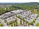 An aerial shot shows a bustling shopping center with ample parking and diverse retail stores at 540 Byrd Mountain Ln, Canton, GA 30114