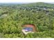 An aerial view displays the home's location surrounded by a lush green forest at 540 Byrd Mountain Ln, Canton, GA 30114