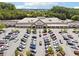 An aerial view of a Publix supermarket with a full parking lot in a commercial area at 540 Byrd Mountain Ln, Canton, GA 30114