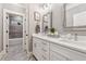 Elegant bathroom with double sinks, white cabinets, modern fixtures, and a view of the shower at 540 Byrd Mountain Ln, Canton, GA 30114