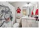 Bathroom features a vanity, mirror, toilet, and themed shower curtain at 540 Byrd Mountain Ln, Canton, GA 30114