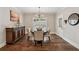 Bright dining room featuring a classic chandelier and a vintage sideboard at 540 Byrd Mountain Ln, Canton, GA 30114