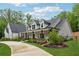 Charming two-story home with a covered porch and professionally landscaped front yard at 540 Byrd Mountain Ln, Canton, GA 30114