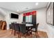 Finished basement game room with a poker table, flat screen TV, and wood flooring at 540 Byrd Mountain Ln, Canton, GA 30114