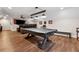 Finished basement game room with a pool table, leather recliners, and a large screen TV at 540 Byrd Mountain Ln, Canton, GA 30114