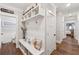 Mudroom with built-in bench, storage cubbies, and coat hooks at 540 Byrd Mountain Ln, Canton, GA 30114