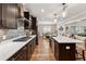 Spacious kitchen featuring a large island, stone backsplash, and modern appliances at 540 Byrd Mountain Ln, Canton, GA 30114