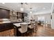 Bright kitchen showcases an island with barstools and stainless steel appliances at 540 Byrd Mountain Ln, Canton, GA 30114