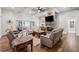Comfortable living room featuring a stone fireplace and hardwood floors at 540 Byrd Mountain Ln, Canton, GA 30114