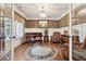 Cozy living room featuring elegant chandeliers and hardwood floors at 540 Byrd Mountain Ln, Canton, GA 30114