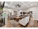 Spacious living room with a stone fireplace and open floor plan to kitchen at 540 Byrd Mountain Ln, Canton, GA 30114
