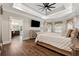 Relaxing main bedroom featuring a tray ceiling and ensuite bathroom access at 540 Byrd Mountain Ln, Canton, GA 30114