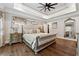 Spacious main bedroom featuring a tray ceiling and hardwood floors at 540 Byrd Mountain Ln, Canton, GA 30114