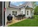 A patio features an outdoor dining set and a grill at 540 Byrd Mountain Ln, Canton, GA 30114