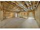 Spacious unfinished basement features framing, concrete walls, and exposed ceiling; ready to be customized at 6175 River Shore Pkwy, Atlanta, GA 30328