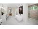 Bright bathroom featuring a standalone tub, walk in shower and modern fixtures at 6175 River Shore Pkwy, Atlanta, GA 30328
