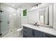 Modern bathroom featuring a glass shower, marble tile, and granite vanity with stylish black fixtures at 6175 River Shore Pkwy, Atlanta, GA 30328