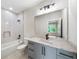 Bathroom with shower-tub combo, custom vanity, and natural light at 6175 River Shore Pkwy, Atlanta, GA 30328