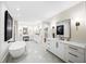 Luxurious bathroom featuring double vanity, soaking tub and elegant marble floors at 6175 River Shore Pkwy, Atlanta, GA 30328