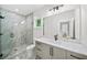 Contemporary bathroom featuring a glass-enclosed shower, marble tile, and granite vanity with stylish fixtures at 6175 River Shore Pkwy, Atlanta, GA 30328