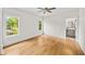 Bright bedroom with gleaming hardwood floors, neutral paint, base trim, and two well-lit windows at 6175 River Shore Pkwy, Atlanta, GA 30328
