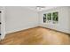 Bright bedroom showcasing hardwood floors and large windows at 6175 River Shore Pkwy, Atlanta, GA 30328