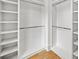 Walk-in closet with custom shelving, drawers, and wooden floors at 6175 River Shore Pkwy, Atlanta, GA 30328