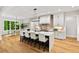 Spacious kitchen featuring a large island with seating and views of the backyard at 6175 River Shore Pkwy, Atlanta, GA 30328