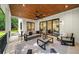 Spacious patio with wood ceiling, ceiling fan, and comfortable outdoor furniture at 6175 River Shore Pkwy, Atlanta, GA 30328