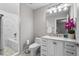 Bathroom featuring marble finishes, modern sink, and combined shower and tub with glass door at 1271 Mackintosh Nw Park # 30, Atlanta, GA 30318