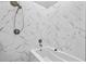 Modern bathroom features a tub and sleek white marble-style tile throughout at 1271 Mackintosh Nw Park # 30, Atlanta, GA 30318