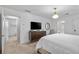 Spacious bedroom with a dresser, mounted TV, and easy access to the ensuite bathrooms at 1271 Mackintosh Nw Park # 30, Atlanta, GA 30318