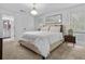 Bright bedroom with neutral tones, plush carpeting, and a view into the ensuite bathroom at 1271 Mackintosh Nw Park # 30, Atlanta, GA 30318