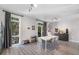 Bright dining room featuring wood floors, natural light, modern table, and stylish decor at 1271 Mackintosh Nw Park # 30, Atlanta, GA 30318
