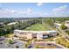 Aerial view of Topgolf showing the driving range, outdoor seating, and ample parking at 1271 Mackintosh Nw Park # 30, Atlanta, GA 30318