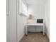 Small home office area with clean desk, task chair, and natural light at 1271 Mackintosh Nw Park # 30, Atlanta, GA 30318