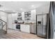 Stylish kitchen featuring stainless steel appliances, white cabinets, and sleek countertops at 1271 Mackintosh Nw Park # 30, Atlanta, GA 30318