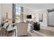 Bright living room with tall windows, stylish furnishings, and elegant decor at 1271 Mackintosh Nw Park # 30, Atlanta, GA 30318