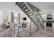 Modern living room featuring a unique staircase and an open layout to the kitchen area at 1271 Mackintosh Nw Park # 30, Atlanta, GA 30318