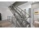 Modern staircase with metal railings, hardwood flooring, and contemporary design at 1271 Mackintosh Nw Park # 30, Atlanta, GA 30318