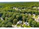 Aerial view of the home nestled among lush greenery and foliage in a lovely neighborhood at 2401 Stockton Dr, Marietta, GA 30066